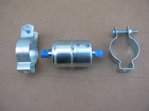 Electrical conduit clips are used to mount the first fuel filter to the chassis